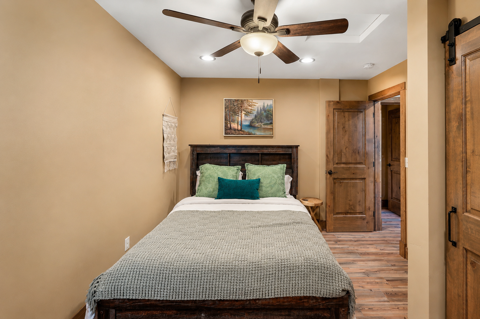 Granite Pines Chalet lower floor queen bedroom with warm terracotta walls