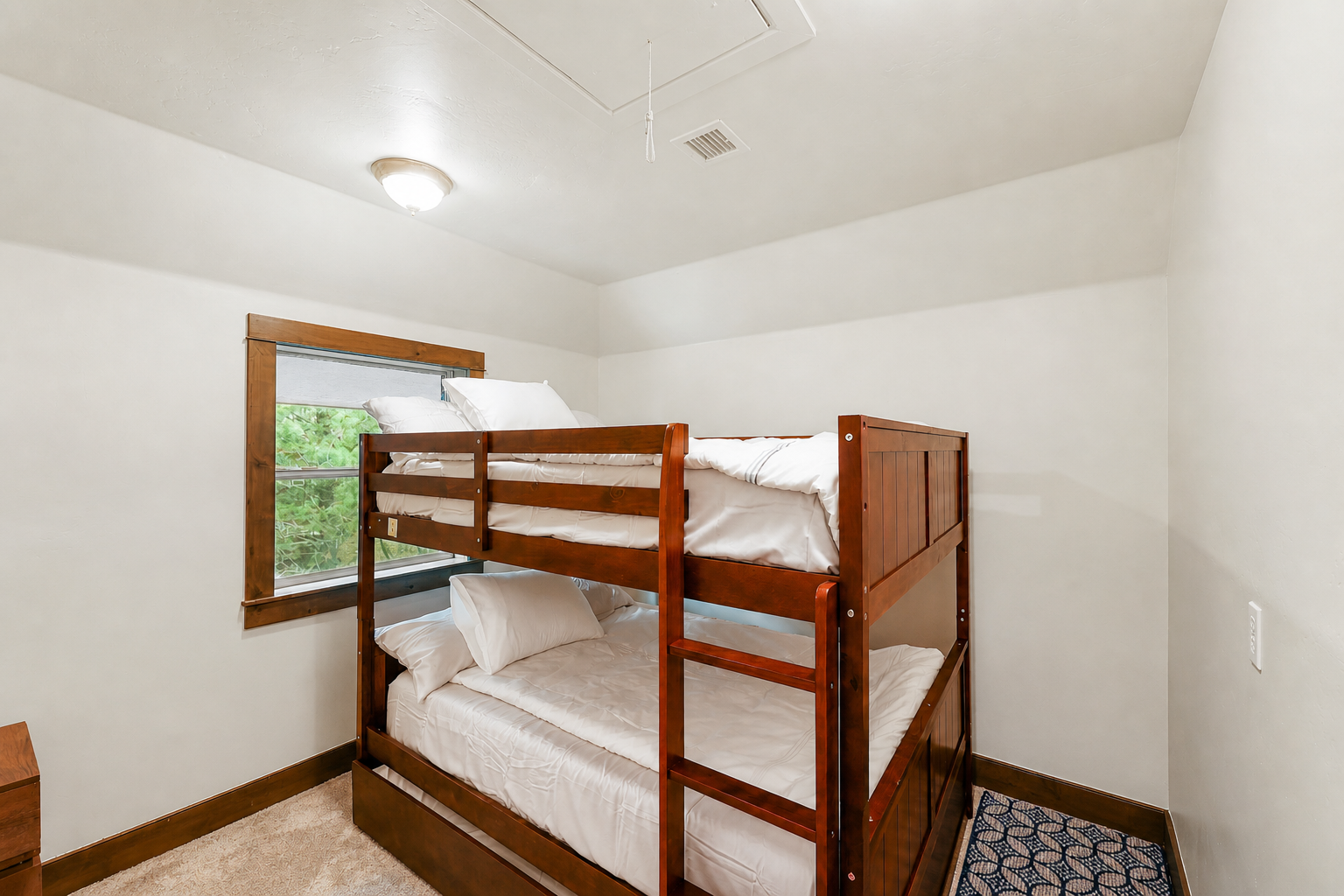 Bunk room with two full bunk beds and pullout
