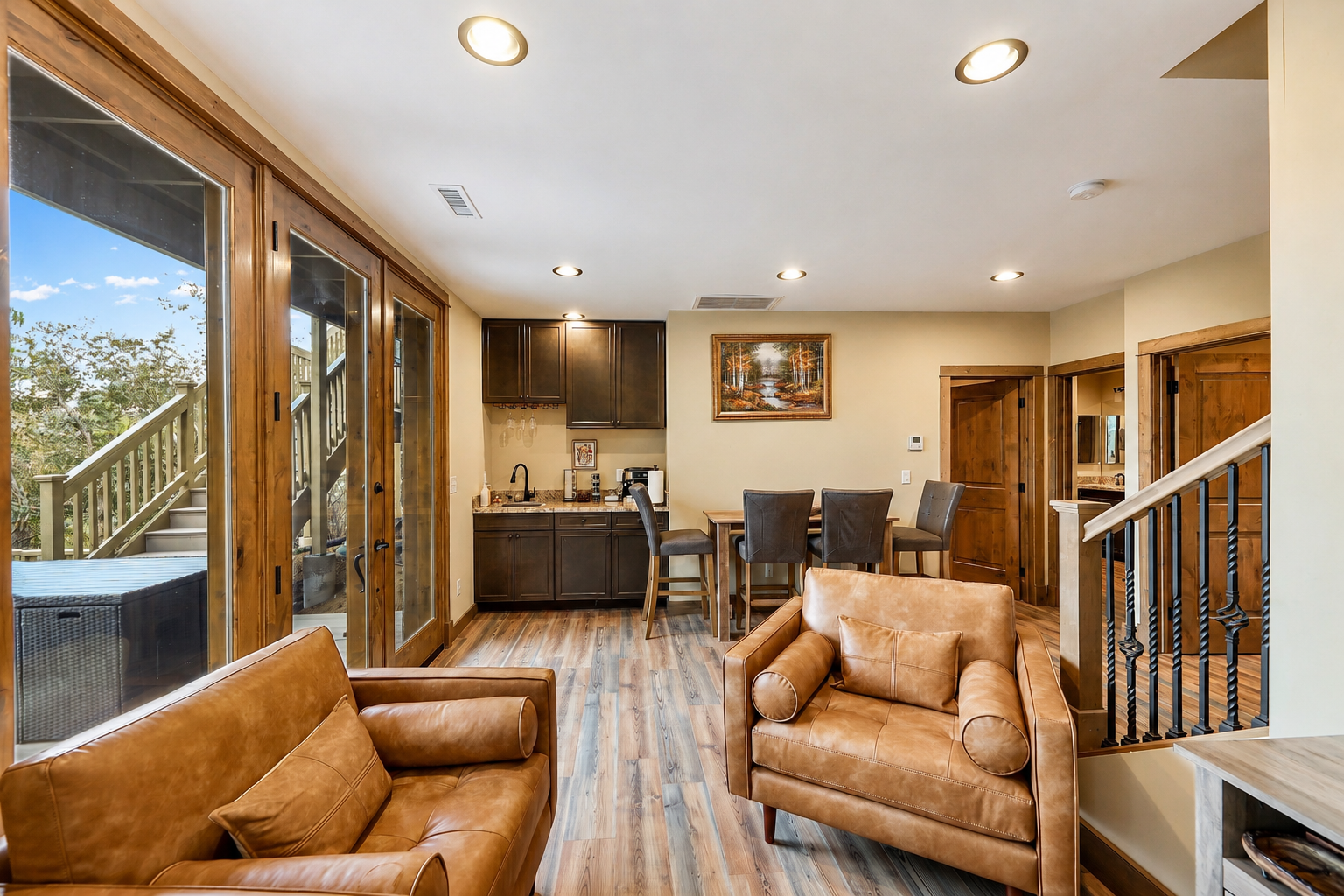 Granite Pines Chalet lower lounge with leather seating and bar area